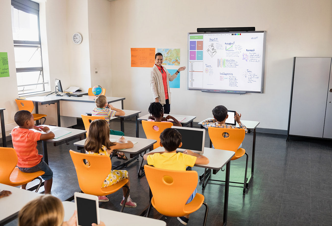 Teacher using the wireless microphone in the class